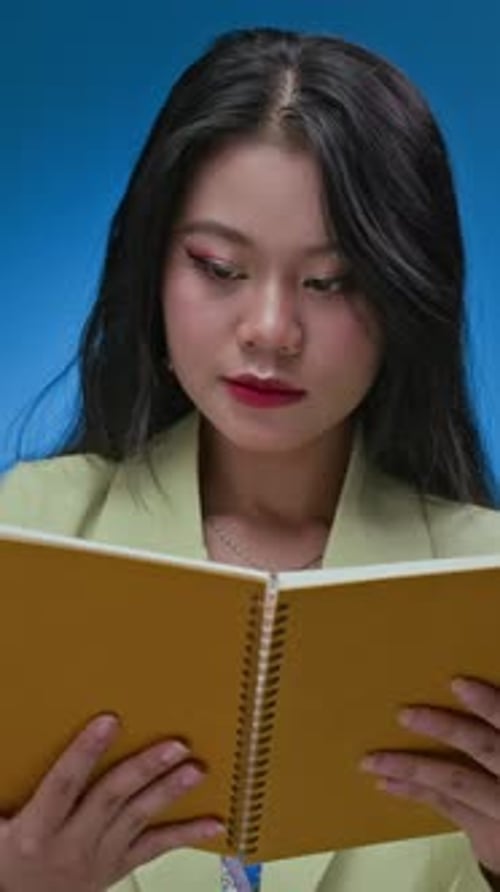 Young Woman Holding Notebook Smiling Portrait