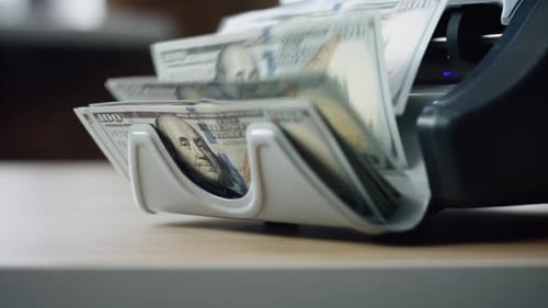 Machine Counting Dollar Bills Close Up