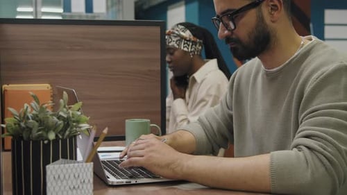 Business Professionals Working at Computers in Modern Office