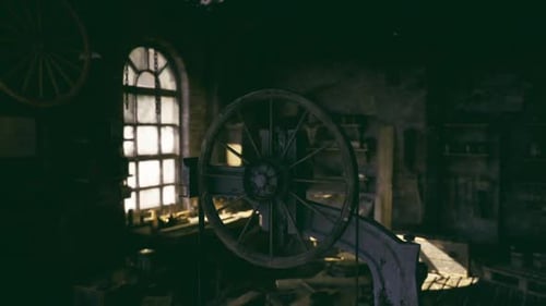 Neglected Vehicle Workshop Showcasing Worn Furniture and Dusty Glass Panes