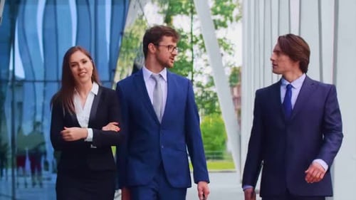 Confident Businesspersons Talking in Front of Modern Office Building Businessmen and Businesswoman