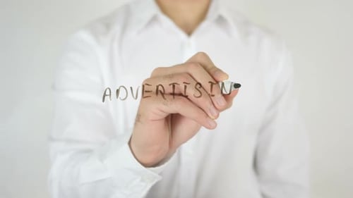 Man Writes Advertising on Clear Surface