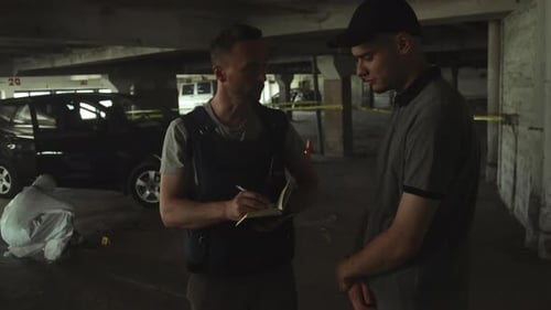 Detective Interviewing Young Adult at Urban Crime Scene