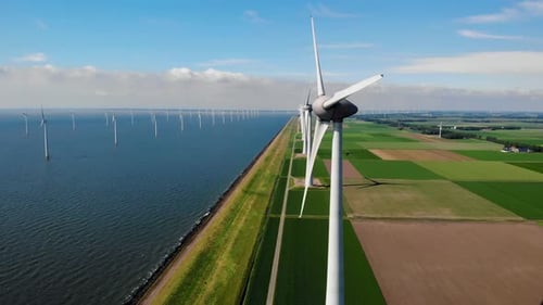 Windmill Turbines at Sea Seen From a Drone Aerial View From Above at a Huge Winmill Park
