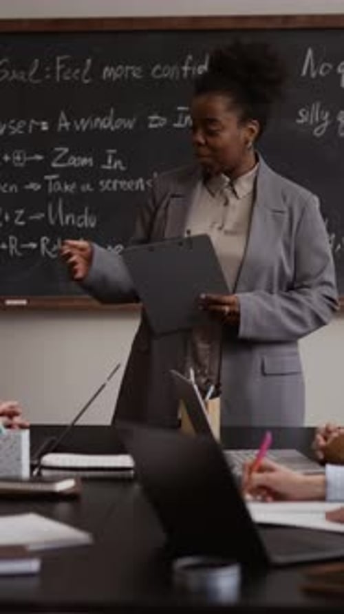 Teacher Helping Senior Adults with Computer Education