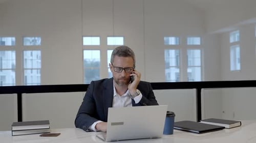 Employee Talking on Phone at Office Boss in Suit Talking on Phone Phone Meeting Business Man Using