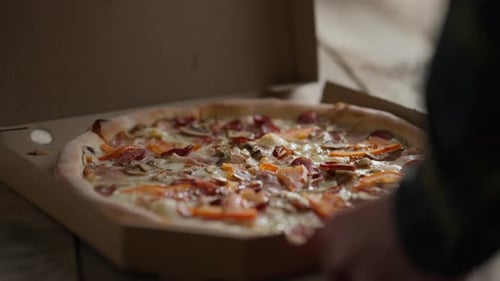 Hot Delicious Pizza in a Cardboard Box