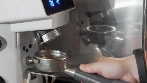 Espresso Machine Dispenses Fresh Coffee Grounds