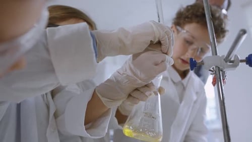 Students Perform Science Experiment in a Lab