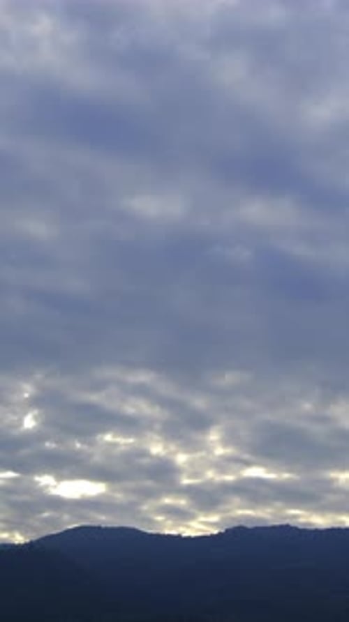 Clouds Moving Across Sky at Sunrise or Sunset