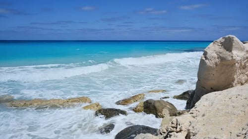 Sea Waves Break Upon Rocks