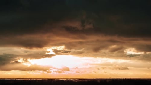 Golden Sunset with Dark Dramatic Clouds Time Lapse