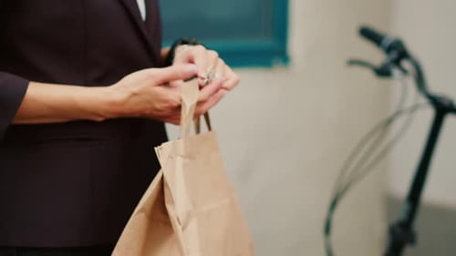 Takeaway Courier Giving Fastfood Order to Customer