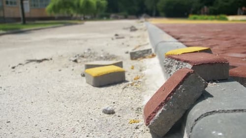 Construction Site Colored Road Paving Stone in a City Park Building Process