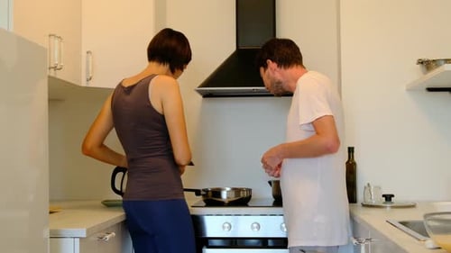 Couple Cooking Together in Modern Kitchen
