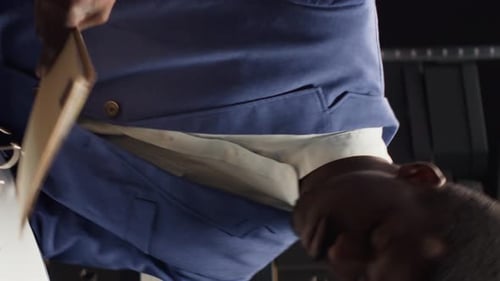 Man Reviews Documents in Office with Woman