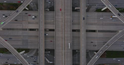 Overhead Drone Footage of Busy Highway Interchange and Urban Traffic