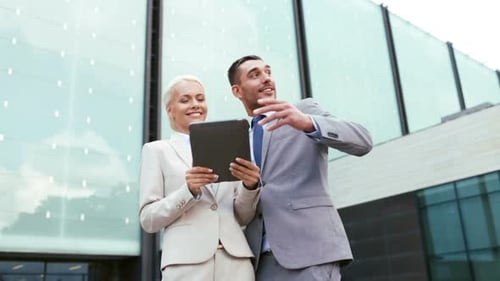 Businesspeople with tablet discuss future plans in city