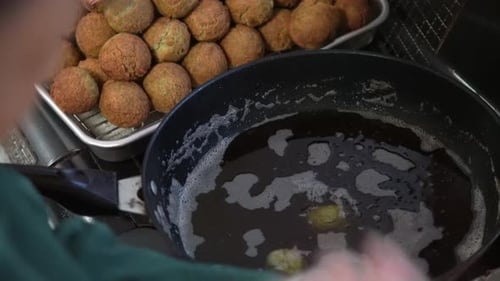 Preparing Crispy Falafel Balls in Restaurant Kitchen