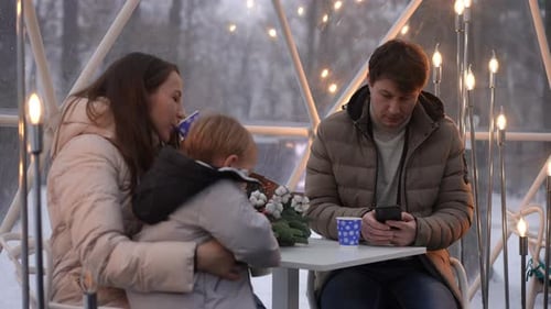 Cozy Family Moment in Winter Igloo