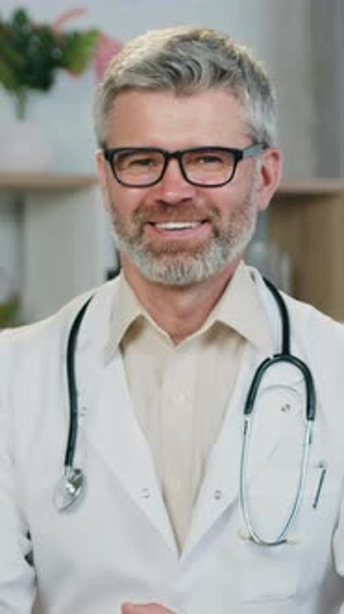 Smiling Doctor Wearing Glasses and White Coat