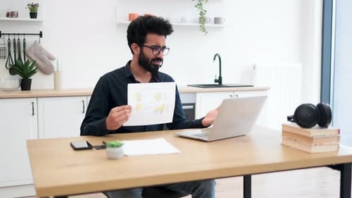 Man Presenting Data During an Online Meeting