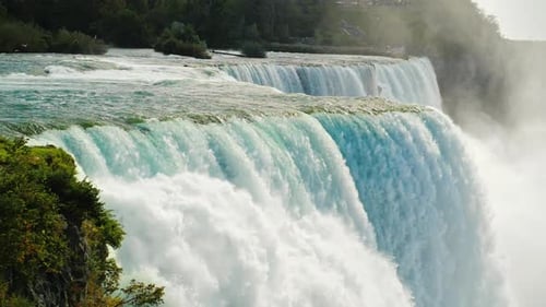 The Swift Flow of Niagara Falls Water Water of a Beautiful Blue Hue Slow Motion Video