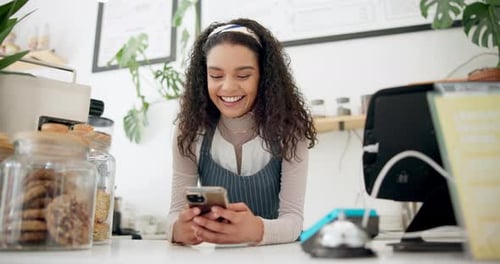 Woman, coffee shop and barista with smartphone for ecommerce, networking or funny conversation