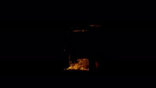 Burn Collection: A 4k three quarter shot of fire burning down a frame on a black background shot at