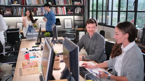 Colleagues Collaborating at Modern Office Workplace