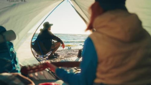 Summer Happiness People Resting in Camping on Shore of Sea or Wide River Travelers Relaxing After