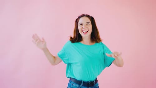 A Joyful Dance Takes Place Against a Vibrant Pink Backdrop Embodying a Carefree Spirit with Beauty