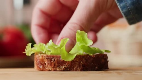 Chef Assembling an Open Faced Sandwich