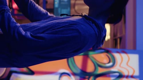 Young adult codes on computer at night