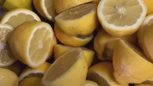 Close up shot of half sliced lemons ready to be squeezed into a delicious healthy juice
