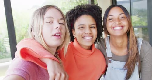 Smiling Young Friends Together Indoors Posing Close