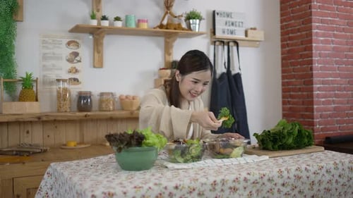Woman Preparing a Healthy Salad in Her Kitchen