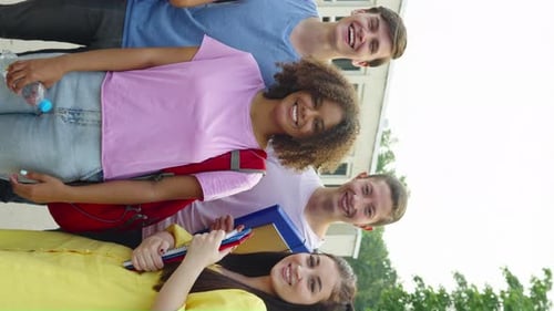 Vertical Screen Diverse Students Laughing at Camera Against College