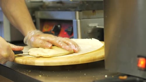 Chef hands skillfully preparing traditional turkish kebab pita flatbread at shop