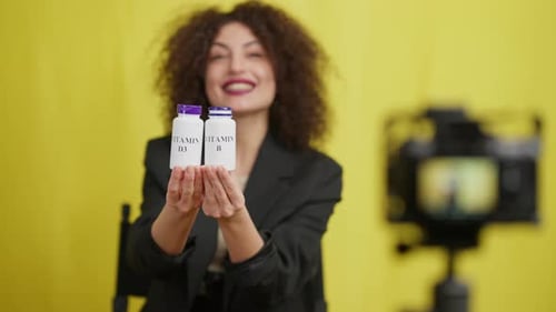Woman Presents Vitamins for Online Health Vlogs