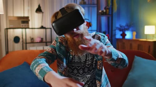 Young Adult Using Virtual Reality Headset at Home