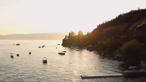 Aerial view of Ohrid Lake at sunset. View of the hills and the church. drone shot.4K.