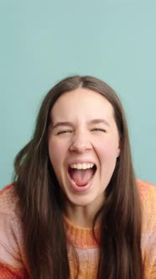 Young Woman Shouting with Open Mouth Excitement