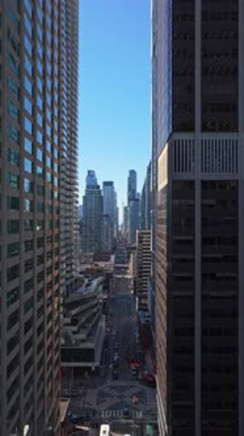 Aerial View of Toronto Downtown Flying Forward Between Modern Glass Skyscrapers to Reveal Urban