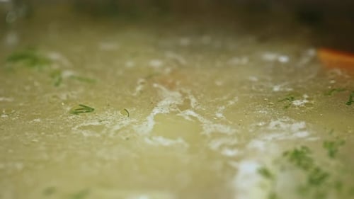 Closeup of Boiling Broth in Pan