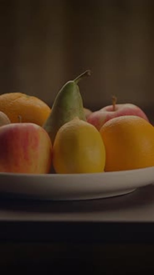 Plate of fresh fruit with oranges and apples