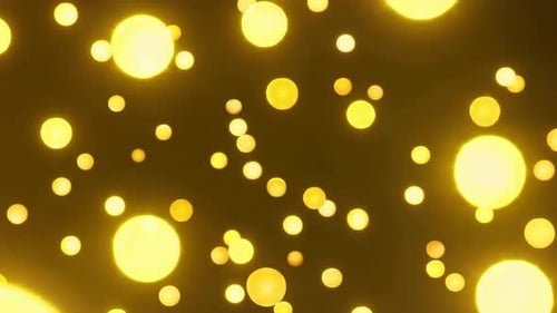 Abstrakte glühende goldene Kugeln, die im dunklen Raum schweben