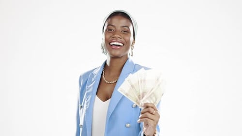 Smiling Woman Holding Cash in a Studio