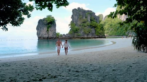 Couple Men and Women on a Tropical White Beach in Thailand Koh Hong Island Krabi