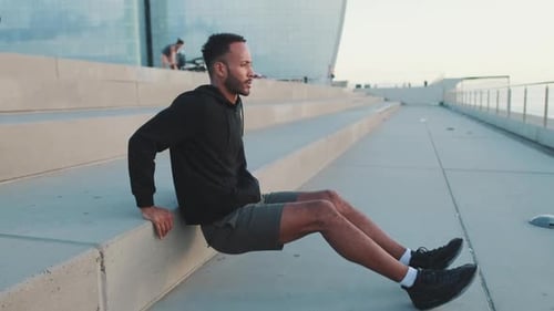 Man Doing Tricep Dips on Concrete Steps